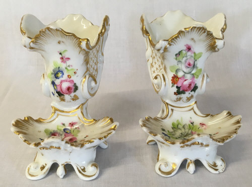 Pair of small porcelain gilded cornucopia vases with shallow bowls to front with hand painted