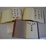 2 stamp albums of world stamps and another stamp album of GB stamps