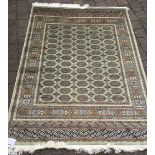 Green ground Bokhara rug 1.90m by 1.