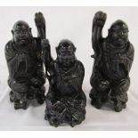 3 carved ebony buddha style figures 30 cm and 23 cm