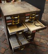 Watchmakers cabinet including mainsprings, watch movements, lathe tools, gravers, washers,