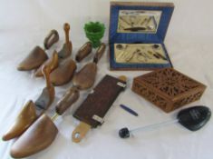 Selection of wooden shoe stretchers, press, vase,