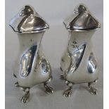 Pair of silver Art Nouveau pepperettes of twisted form, maker Charles Clement Pilling,