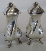 Pair of silver Art Nouveau pepperettes of twisted form, maker Charles Clement Pilling,
