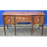 George III serpentine front mahogany sideboard on tapering fluted legs with Adam style carved