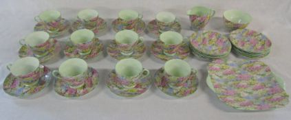 Shelley 'Rock Garden' pattern 12 place tea set consisting of cups, saucers, plates, sugar bowl,