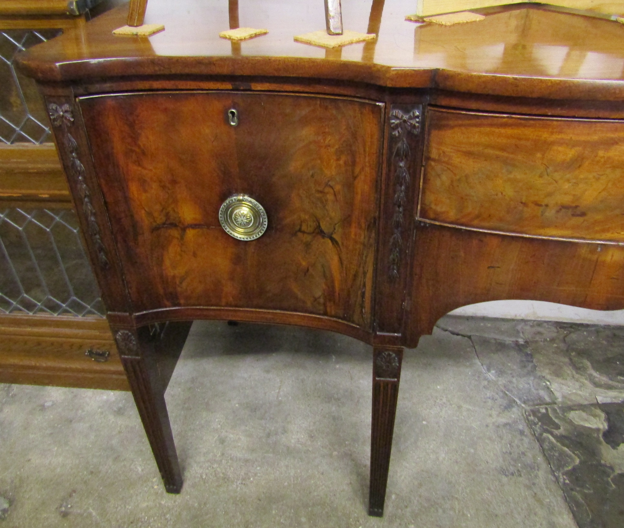 George III serpentine front mahogany sideboard on tapering fluted legs with Adam style carved - Image 6 of 11