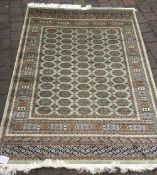 Green ground Bokhara rug 1.90m by 1.