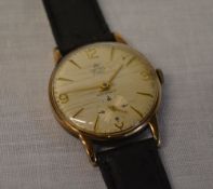 9ct gold body Smiths Deluxe gents wristwatch on a leather strap