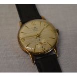 9ct gold body Smiths Deluxe gents wristwatch on a leather strap