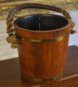 Brass bound wooden pail with rope and leather handle