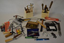 Watchmakers hand tools including small hammers, various size hacksaws,