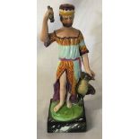 Staffordshire ceramic figure of a man holding a bundle of sticks next to an eagle on a marble