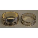 Foreign silver napkin ring decorated with niello shipping scenes and one other decorated with the
