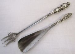Silver handled shoe horn & a silver handled ornate pickle fork