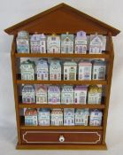 Brooks & Bentley spice village consisting of 24 ceramic houses and display case with drawer