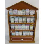 Brooks & Bentley spice village consisting of 24 ceramic houses and display case with drawer