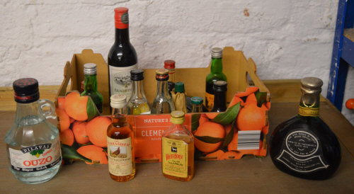 Various alcoholic miniatures including The Famous Grouse, Ouzo,