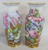 Pair of late 19th century hand painted vases of flowers (one with chip to base)