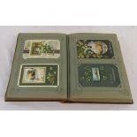 Postcard album containing approximately 300 Christmas and Easter postcards mainly from early 1900s