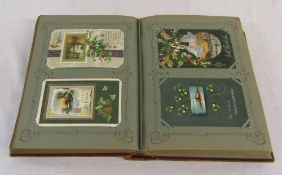 Postcard album containing approximately 300 Christmas and Easter postcards mainly from early 1900s