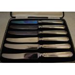 Cased set of 6 knives with silver handles and stainless steel blades,