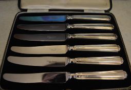 Cased set of 6 knives with silver handles and stainless steel blades,