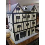 Large four storey Tudor style dolls house and shop fitted for electricity complete with furniture,