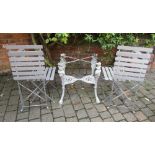 Cast iron table base and 4 folding patio chairs