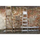 3 step ladders & an extending ladder