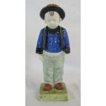 H B Quimper figure of a young boy, designed by Berthe Savigny (chips to base and hat) H 25.
