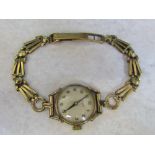 Ladies 9ct gold Tissot watch with 9ct strap complete with box total weight 17.
