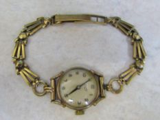 Ladies 9ct gold Tissot watch with 9ct strap complete with box total weight 17.