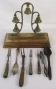 Set of brass troika bells & group of old cutlery inc silver butter/fish knife