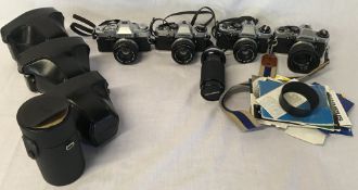 3 Olympus OM10 35mm camera & a OM30 with 3 Olympus cases & an Olympus zoom & close focus lens