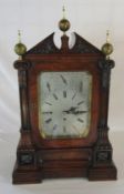 Victorian bracket clock in a walnut case on an inverted breakfront base with Whittington or