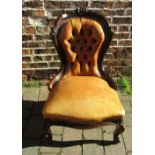 Victorian button back leather nursing chair with ball and claw feet