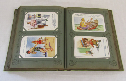 Postcard album containing approximately 170 Donald McGill comic postcards dating from early 1900s
