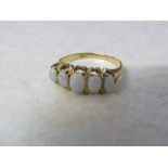Tested as 18ct gold 5 stone opal ring size M