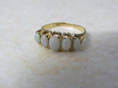 Tested as 18ct gold 5 stone opal ring size M