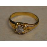 Tested as 18ct gold gents diamond ring in an open claw setting, diamond approx 0.
