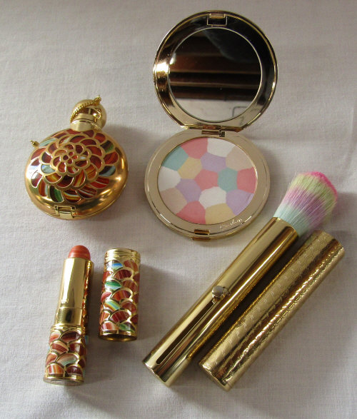 4 piece Guerlain makeup set 'Les Meteorites' consisting of lipstick (used), brush,