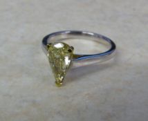 18ct white gold ring set with natural fancy pear brilliant cut yellow 1.