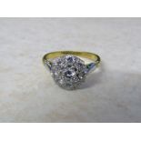 18ct gold and platinum diamond daisy ring (central stone 0.23 ct outer stones 0.40 ct total 0.