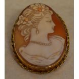 9ct gold large cameo brooch of a lady in profile, with safety chain, total approx weight 12.