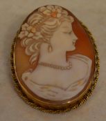 9ct gold large cameo brooch of a lady in profile, with safety chain, total approx weight 12.