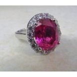 18ct white gold ring set with a single 8.8ct ruby (13 x 10 x 6 mm) and approximately 1.