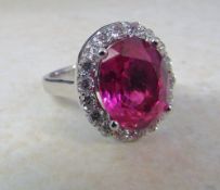 18ct white gold ring set with a single 8.8ct ruby (13 x 10 x 6 mm) and approximately 1.