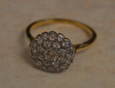 Tested as 18ct gold diamond cluster ring,