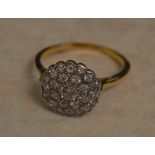 Tested as 18ct gold diamond cluster ring,